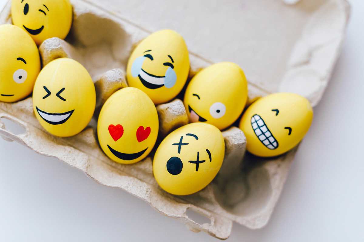 various expression in yellow painted egg